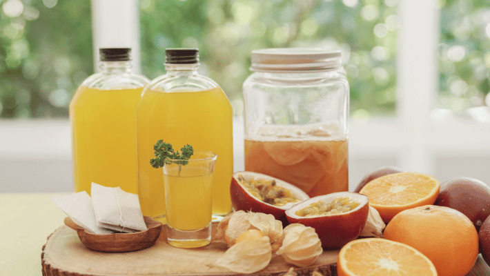 Advantages of Homemade Probiotics for Dogs- Assorted fresh fruits, lemon, orange, tea leaves, and ayurvedic ingredients, highlighting the benefits of homemade probiotics for dogs